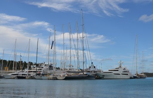 motor and sailing yachts lined up for the Antigua Charter Yacht Show