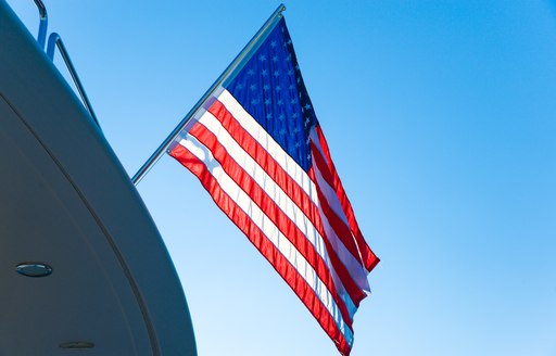 A US Flag flying on the back of a yacht