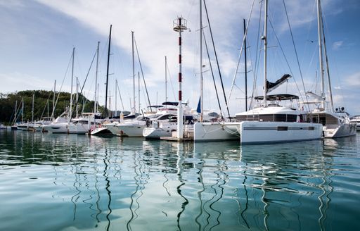 yachts line up for the Thailand Yacht Show & Rendezvous in Phuket, Thailand
