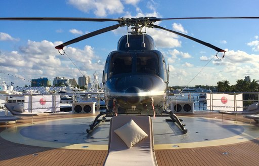 helicopter on the helipad of charter yacht CLOUDBREAK at FLIBS 2017