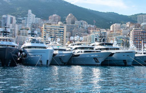 A line of superyacht charters berthed in Port Hercule