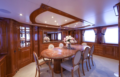 formal dining area in the classically styled main salon aboard charter yacht DXB 