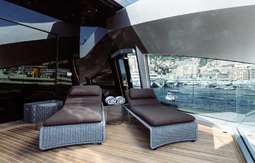 Sun loungers on the aft deck onboard charter yacht THIS IS IT