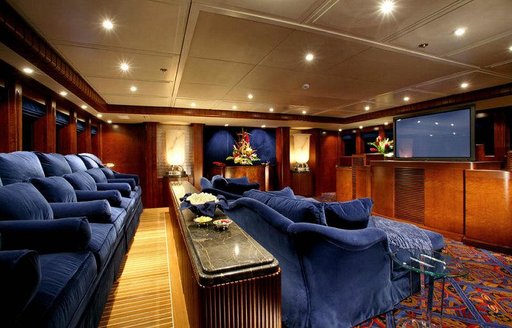 Plush interior cinema onboard charter yacht NOMAD