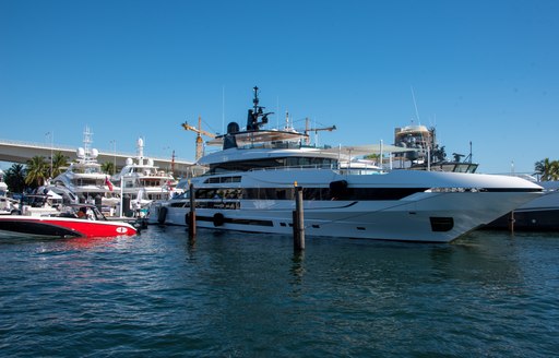 Superyachts berthed at FLIBS on a sunny day.