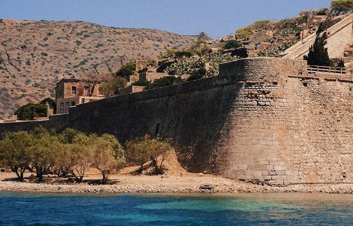 Water-level view of historic architecture on Spinalonga Island