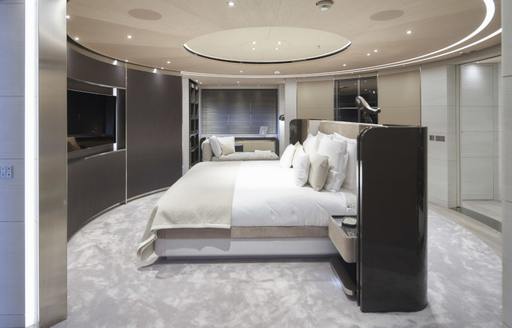 Large cabin on superyacht SEVERIN'S with king sized bed viewed from the side