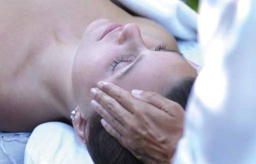 woman receiving a relaxing head massage by one of belmond la samanna's expert masseurs 