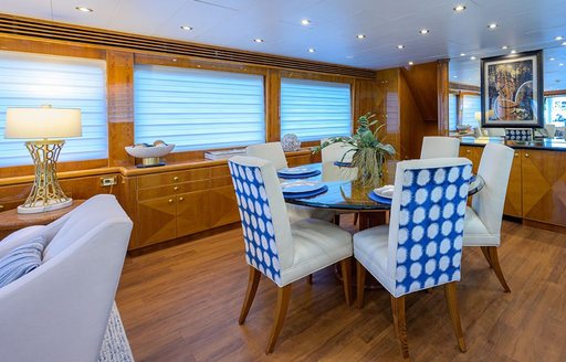 Interior dining area onboard charter yacht NEXT CHAPTER