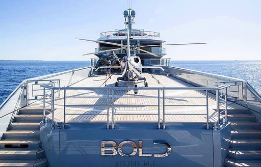 Aft deck with helicopter on board charter yacht BOLD