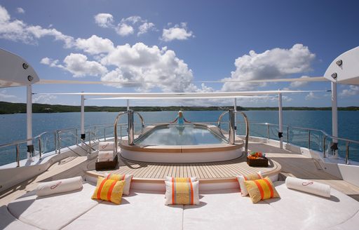 Swimming pool onboard charter yacht AMARYLLIS, with sun pads in the foreground