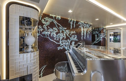 A grand piano on charter yacht PARILLION