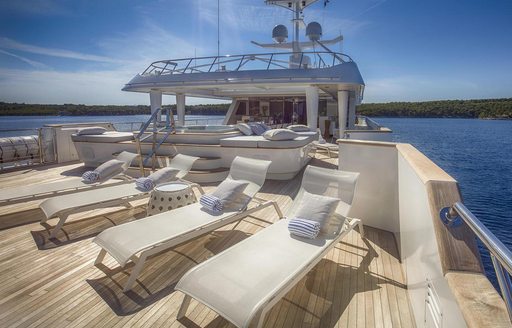 loungers line up on the sundeck aft of luxury yacht KATINA