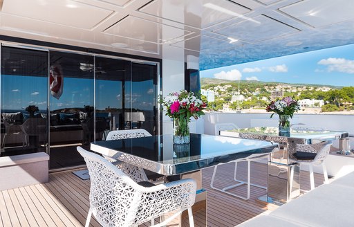 Covered dining area on deck of motor yacht Cinquanta 50