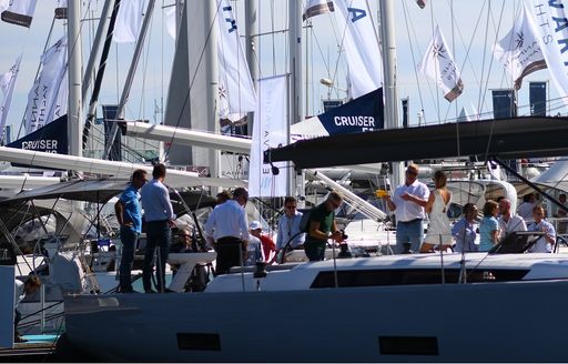 visitors aboard a sailing yacht at the Cannes Yachting Festival 2017