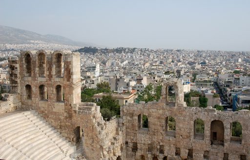 Overview of Athens city rooftops and ruins in foreground