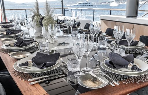 Fully laid dining table on superyacht SEVERIN'S