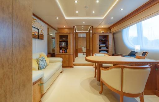 Charter yacht AZUL V private lounge and desk by window