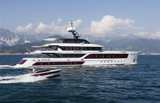 Charter yacht QUINTA ESSENTIA at sea with tender