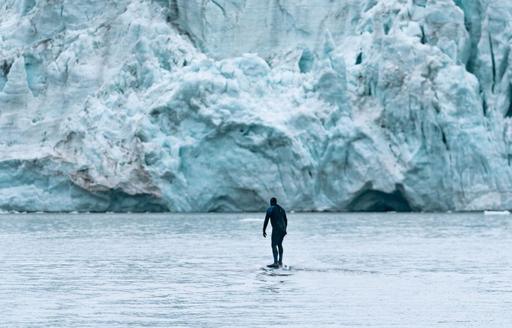 Charter guest approaching glacier on water toy