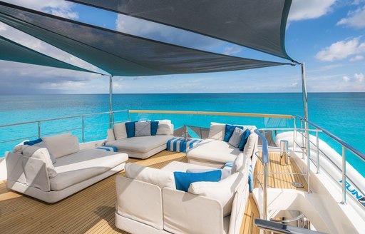 Overview of an alfresco lounge area onboard charter yacht HALCYON