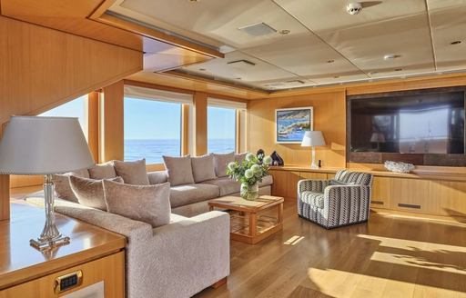 Charter yacht OASIS upper salon with lounge seating