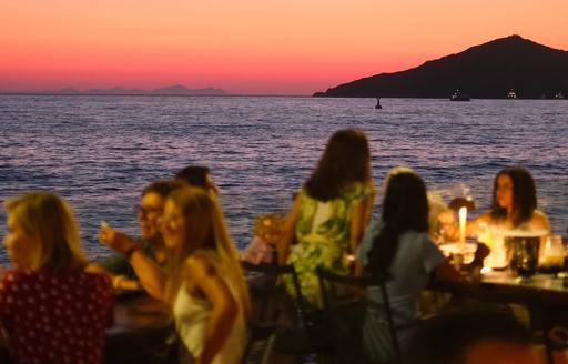 Diners at Nusr-et on beach