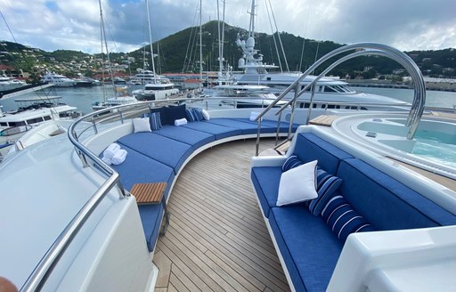 Steps coming out of Jacuzzi towards sundpads on superyacht Chasing Daylight