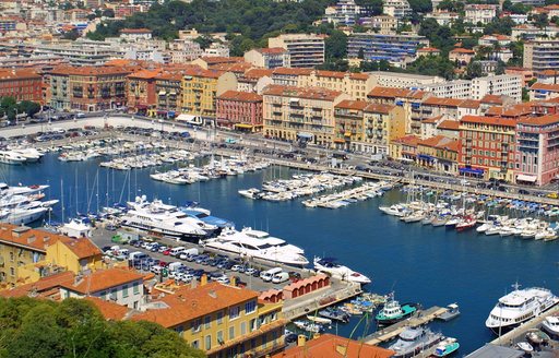 Overhead view looking down on a marina in Nice, with many motor yacht charters berthed