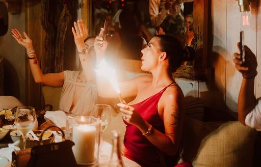 Ladies at La Petite Plage with indoor fireworks