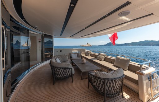 View of aft deck terrace with comfortable seating on Motor yacht 'My Way'