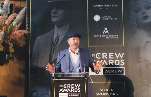 Man presenting awards at the Crew Awards