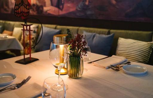Dining table with floral arrangement at Amalur Ibiza