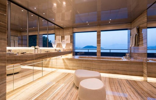 Beautiful en-suite on superyacht SAVANNAH with bath and windows looking out to see