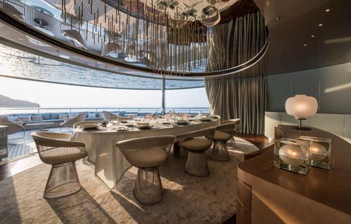 Covered outdoor dining area on superyacht SAVANNAH