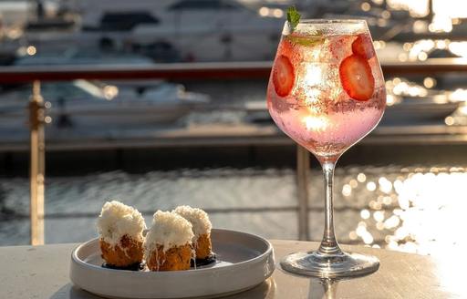 Mika Abu Dhabi drink, food, sea view