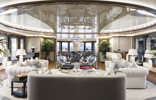 Interiors onboard superyacht charter AHPO, spacious lounge area with opulent furnishings