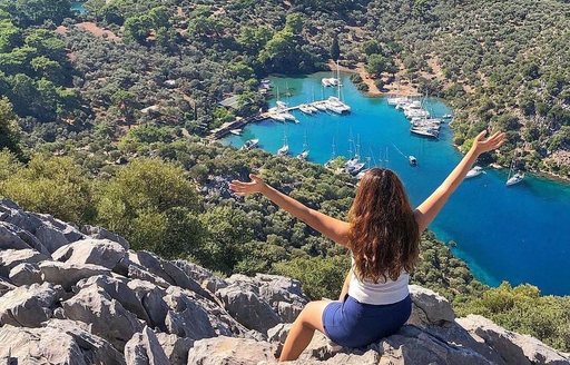 Girl overlooking Kapi Creek, beautiful view, turquoise waters