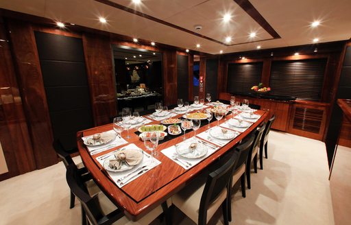 sleek dining area in the main salon of luxury yacht Barracuda Red Sea