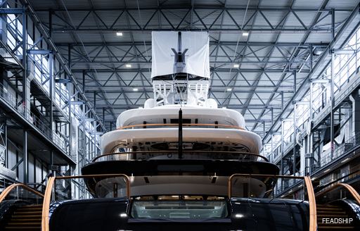 Aft view of Feadship Project 821 in a construction shed