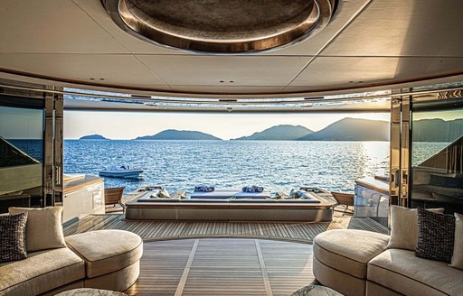 Doors open and looking out across beach club area on Benetti superyacht REBECA