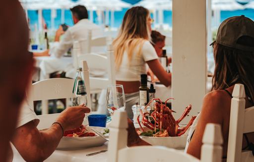 Porto Cervo - White Beach Club dining area people