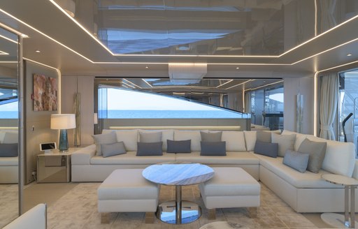 Comfortable pale seating on superyacht EIV