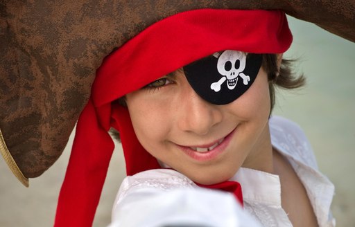 A child dressed up as a pirate on board a charter yacht