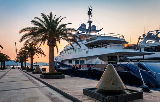 A yacht is moored in a marina