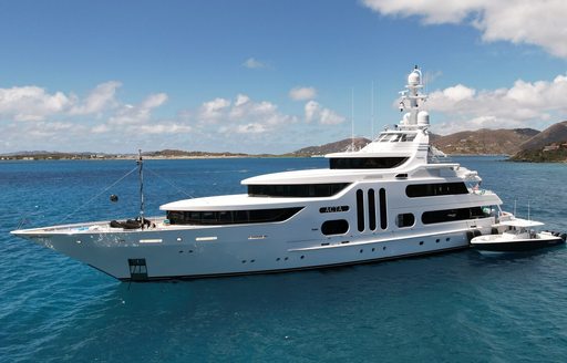 Charter yacht ACTA at anchor with tender adjacent