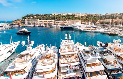 Overview of Port Hercule, Monaco, with many motor yacht charters berthed