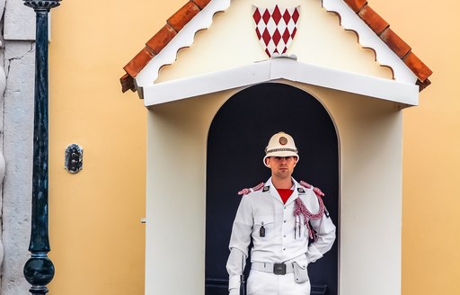 guard outside doors to palace in monaco