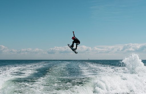 E-surfboarder flying above the waves