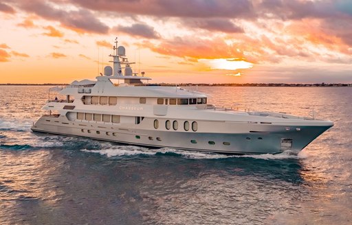 Charter yacht CHASSEUR underway, surrounded by sea at sunset